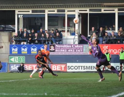 Paul Jones keeps out this attempt at goal by Dan Potts