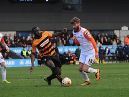 Paddy McCourt goes past Bondz Ngala