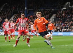 Cameron McGeehan charges forward with the ball