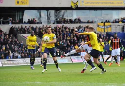 Olly Lee shoots past future Hatter Johnny Mullins for Town`s second goal
