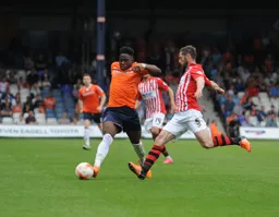 Pelly-Ruddock Mpanzu drives forward with the ball