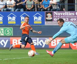 Jack Marriott tries to round the keeper