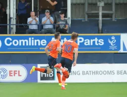 Stephen O'Donnell anf Jordan Cook celebrate a goal