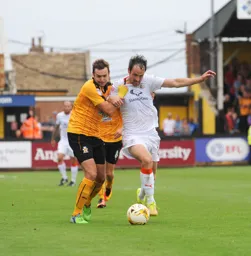 Danny Hylton in a battle for the ball