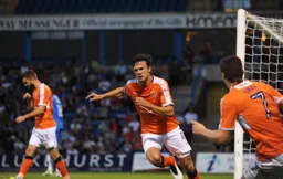 Jonathan Smith wheels away after scoring Town`s second goal