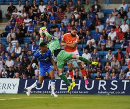 Josh McQuoid challanges the goalkeeper