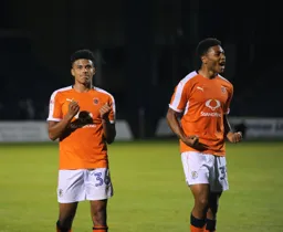 James Justin and Akin Famewo celebrate with the fans