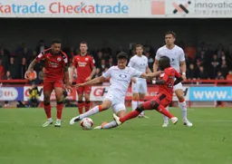 Jonathan Smith shows great determination to win the ball