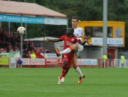 Dan Potts clears the ball