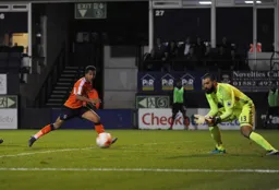 Boaz Myhill about to gather the ball as Zane Banton follows up