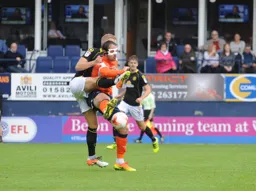 Danny Hylton controls the ball under pressure
