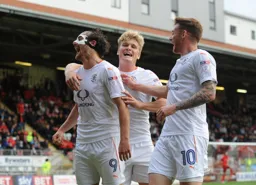 Danny Hylton, Cameroon McGeehan and Jordan Cook celebrating