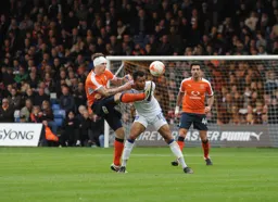 Glen Rea with a head wound looks as though he is trying to inflict the same on Matt Green