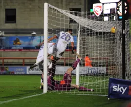 Isaac Vassell bundles the ball into the net for the second goal