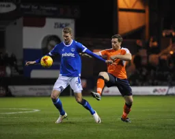 Michael Smith shields the ball from Johnny Mullins