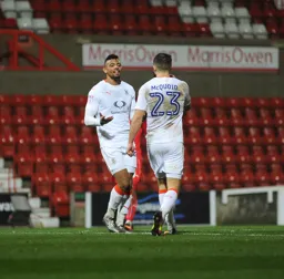 Isaac Vassell and Josh McQuoid celebrate