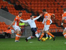 Jack Marriott lunges in to tackle Danny Pugh