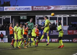 Anxious eyes follow the ball but it drifts wide