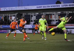 Johnny Mullins tries his luck from the edge of the penalty area