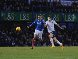 Danny Hylton battles for the ball