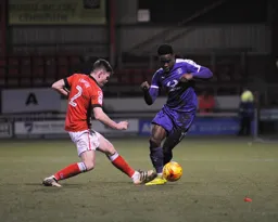 Pelly-Ruddock Mpanzu goes past Ollie Turton