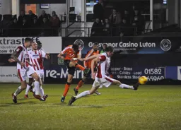 Jonathan Smith fires in a shot at goal