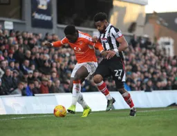 Pelly Mpanzu holding off his man