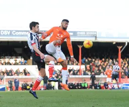 Isaac Vassell wins the ball