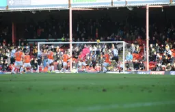 Stuart Moore fists the ball away from danger