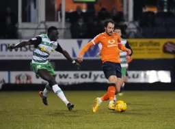 Danny Hylton comes away with the ball