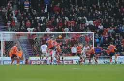 Glen Rea heads the ball clear as the Town defend deep