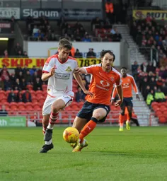 Danny Hylton trying to go beyond the opposition player