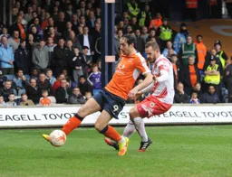 Danny Hylton first to the ball