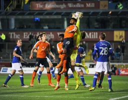 Mark Gillespie snatches the ball off of Issac Vassell`s head