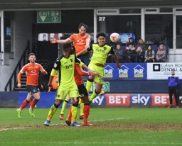 Danny Hylton scores with a strong header