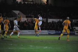 Glen Rea climbs above Sean Rigg to win a header