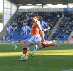 Lawson D'Ath is about to cross the ball