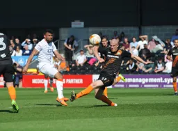 Isaac Vassell sends a shot past Charlie Clough