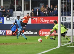 Sam Sargeant dives to save this effort from Alan Sheehan