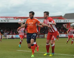 Ollie Palmer holds off Mark Hughes