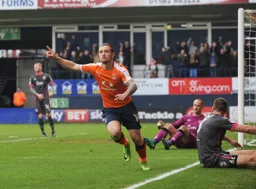 Jack Marriott turns away to celebrate after scoring Town`s second goal