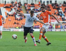 Olly Lee protects the ball