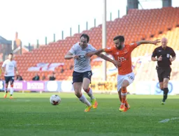 Danny Hylton battling for the ball