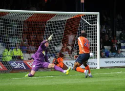 Isaac Vassell scores his second and Town`s fifth goal