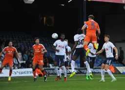 Johnny Mullins wins an attacking header