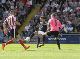 Dan Potts lines up a shot at goal