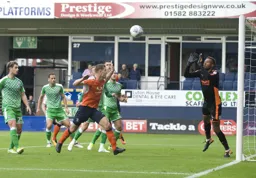 James Collins closes in as Lawrence Vigouroux prepares to catch the ball
