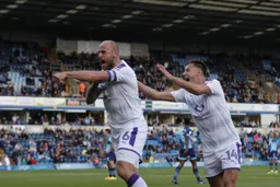 Scott Cutbert celebrates his goal with Harry Cornick