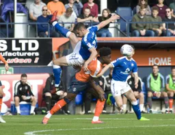 Jordan Flores takes a ride on Pelly-Ruddock Mpanzu`s back