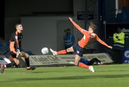 Andrew Shinnie is at full stretch to try and reach the ball